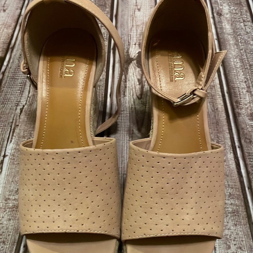 A.n.a size 8 pair of tan platform shoes.